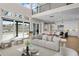 Bright living space featuring an open floor plan, high ceilings, and large sliding glass doors to the exterior at 8014 Trinity Peak Ln, Castle Rock, CO 80108