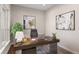Cozy office space with a wooden desk, comfortable chair, natural light and stylish artwork at 8014 Trinity Peak Ln, Castle Rock, CO 80108