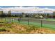 Community tennis courts feature beautiful views and shade structures at 8014 Trinity Peak Ln, Castle Rock, CO 80108