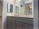 Bathroom boasting a double vanity with modern countertops and spacious cabinets at 1011 S Ironton St # 107, Aurora, CO 80012