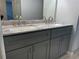 Bathroom featuring a double vanity with modern fixtures and ample countertop space at 1011 S Ironton St # 107, Aurora, CO 80012