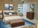 Cozy bedroom showcasing a comfortable bed, stylish decor, and bright natural light at 1011 S Ironton St # 107, Aurora, CO 80012