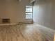 Empty bedroom provides ample space and natural light from a large window at 1011 S Ironton St # 107, Aurora, CO 80012