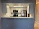 Modern kitchen with stainless steel appliances and white cabinets at 1011 S Ironton St # 107, Aurora, CO 80012