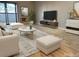 Bright living room featuring stylish furniture, modern decor, and a sliding door for natural light at 1011 S Ironton St # 107, Aurora, CO 80012