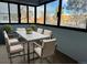 Enclosed sunroom with lots of natural light, perfect for dining or relaxing with views at 1011 S Ironton St # 107, Aurora, CO 80012