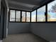 The sunroom has large windows and carpeted floors at 1011 S Ironton St # 107, Aurora, CO 80012