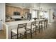 Modern kitchen with stainless steel appliances, an island, and bar stool seating at 21004 E 63Rd Dr, Aurora, CO 80019