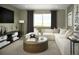 Cozy entertainment room with a comfortable sofa and a view of the outdoors at 21004 E 63Rd Dr, Aurora, CO 80019