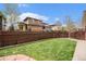 Well-maintained backyard features green lawn and privacy fence at 3375 N Willow St, Denver, CO 80238