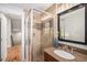 Bathroom featuring a glass-enclosed shower, granite vanity, and decorative accents at 3375 N Willow St, Denver, CO 80238