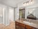 Large bathroom featuring a double vanity, granite countertops, and a glass-enclosed shower at 3375 N Willow St, Denver, CO 80238