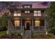 Striking brick home with a covered front porch, landscaped yard, and classic architectural details at 3375 N Willow St, Denver, CO 80238