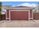 Detached garage with red siding and white trim at 3375 N Willow St, Denver, CO 80238