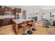 Well-equipped kitchen featuring stainless steel appliances, a large island, and direct access to the living area at 3375 N Willow St, Denver, CO 80238