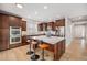 Modern kitchen featuring a large island with seating, stainless steel appliances, and custom cabinetry at 3375 N Willow St, Denver, CO 80238