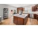 Spacious kitchen island with elegant countertops, ample storage, and convenient access to the backyard at 3375 N Willow St, Denver, CO 80238