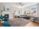 Bright and airy living room with a cozy fireplace, hardwood floors, and a comfortable seating area at 3375 N Willow St, Denver, CO 80238