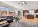 Comfortable living room with hardwood floors, large windows, and easy access to the kitchen area at 3375 N Willow St, Denver, CO 80238
