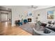 Inviting living room with a fireplace, hardwood floors, and stylish decor, perfect for relaxing and entertaining at 3375 N Willow St, Denver, CO 80238