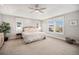 Spacious main bedroom with ample natural light, a ceiling fan, and neutral décor at 3375 N Willow St, Denver, CO 80238