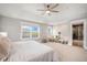 Large main bedroom with ample natural light, sitting area, and ensuite bathroom access at 3375 N Willow St, Denver, CO 80238