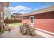 Lovely patio featuring an outdoor dining area and views of the backyard at 3375 N Willow St, Denver, CO 80238