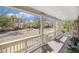 Inviting covered porch with white columns, offering a relaxing outdoor space with neighborhood views at 3375 N Willow St, Denver, CO 80238