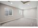 Finished basement featuring recessed lighting, neutral carpet, and egress windows at 2377 S Humboldt St, Denver, CO 80210