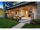 Inviting covered porch with stylish seating and well-maintained landscaping at 2377 S Humboldt St, Denver, CO 80210