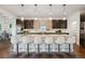 Gorgeous kitchen with expansive island, breakfast bar, and sleek cabinetry at 2377 S Humboldt St, Denver, CO 80210