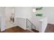 Second floor hallway leading to laundry room featuring washer and dryer, cabinets and natural light at 2377 S Humboldt St, Denver, CO 80210