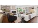 Bright living room with a fireplace, ample seating, and large windows for natural light at 2377 S Humboldt St, Denver, CO 80210