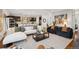 Spacious living room with an open floor plan, modern furniture, and abundant natural light at 2377 S Humboldt St, Denver, CO 80210