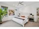 Spacious main bedroom with a ceiling fan, neutral decor, and views of the neighborhood at 2377 S Humboldt St, Denver, CO 80210