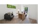 Comfortable home office featuring a modern desk, chair, and large windows with natural light at 2377 S Humboldt St, Denver, CO 80210