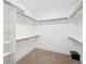Large walk-in closet with multiple shelves and rods for ample storage space at 2377 S Humboldt St, Denver, CO 80210