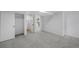 Clean, carpeted basement bedroom with closet, access to stairs and a laundry area at 4176 Zenobia St, Denver, CO 80212