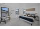 Bright bedroom with black trimmed windows, sleek furniture, and plush carpeting at 4176 Zenobia St, Denver, CO 80212