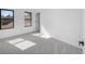 Sunlit bedroom features neutral carpet, and a view of the outdoors through windows at 4176 Zenobia St, Denver, CO 80212