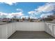 Rooftop deck with white railings and wooden floors, offering panoramic neighborhood views at 4176 Zenobia St, Denver, CO 80212