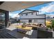 Outdoor living space featuring a spacious deck with comfortable seating and an outdoor kitchen at 4176 Zenobia St, Denver, CO 80212