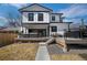 Back exterior elevation with a spacious deck, modern railings, and outdoor cooking at 4176 Zenobia St, Denver, CO 80212