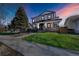 Inviting two-story home boasts professional landscaping and striking modern black and white exterior at 4176 Zenobia St, Denver, CO 80212