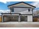Spacious three car garage, with modern architecture and ample parking for multiple vehicles at 4176 Zenobia St, Denver, CO 80212