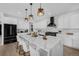 Spacious kitchen features a large center island with pendant lighting and seating at 4176 Zenobia St, Denver, CO 80212