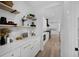 Gourmet kitchen featuring white cabinetry, marble countertops, and modern stainless steel appliances at 4176 Zenobia St, Denver, CO 80212