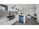 Modern kitchen with stainless steel sink, white countertops, and colorful accents at 4176 Zenobia St, Denver, CO 80212