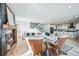Open-concept living room with a modern fireplace and stylish furnishings at 4176 Zenobia St, Denver, CO 80212