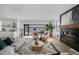 Open concept living room with fireplace and access to an outdoor patio at 4176 Zenobia St, Denver, CO 80212